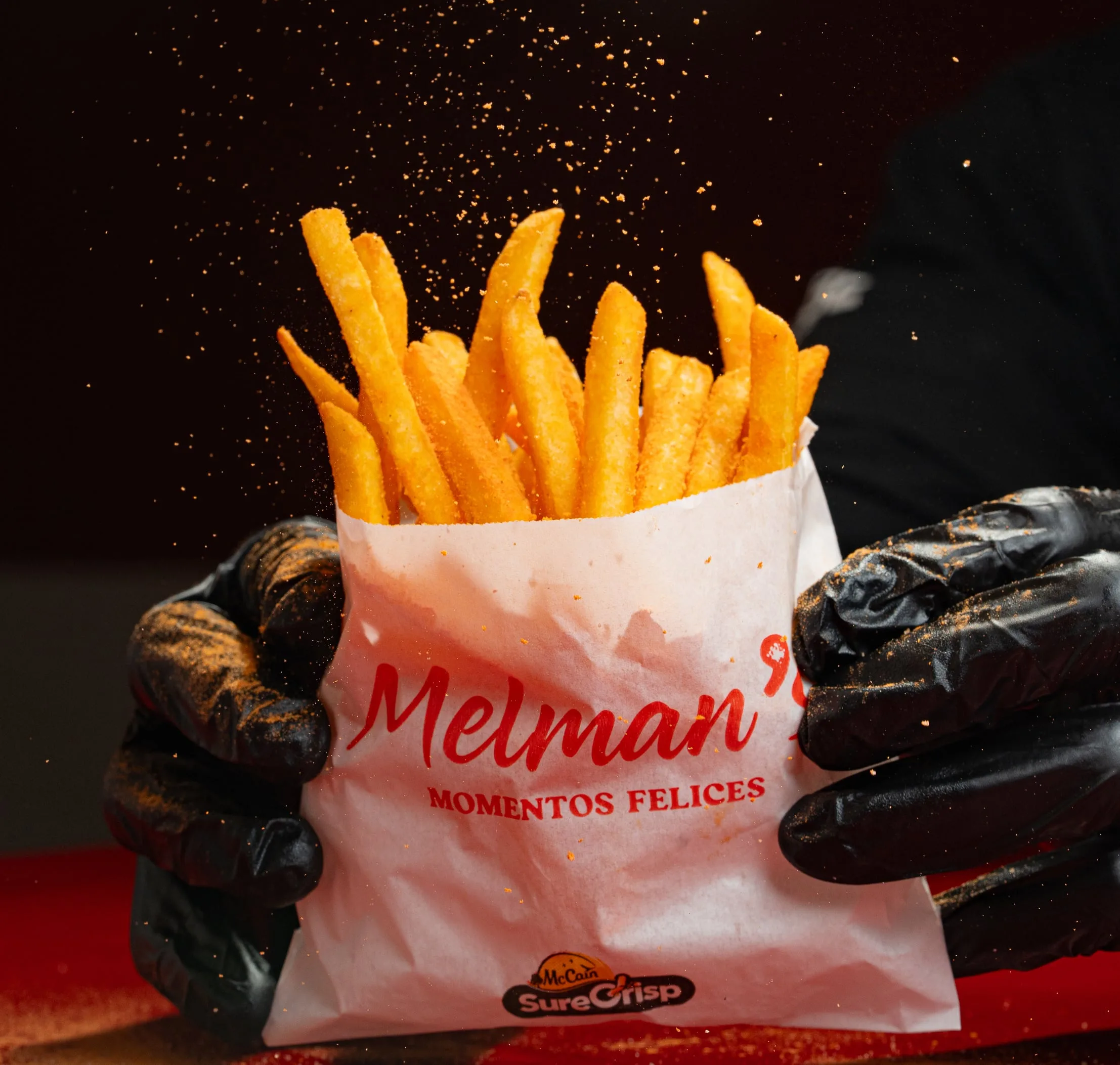 Papas Melman’s: Papas fritas en bolsa, con el condimento de la casa. Se piden solas o con todo.